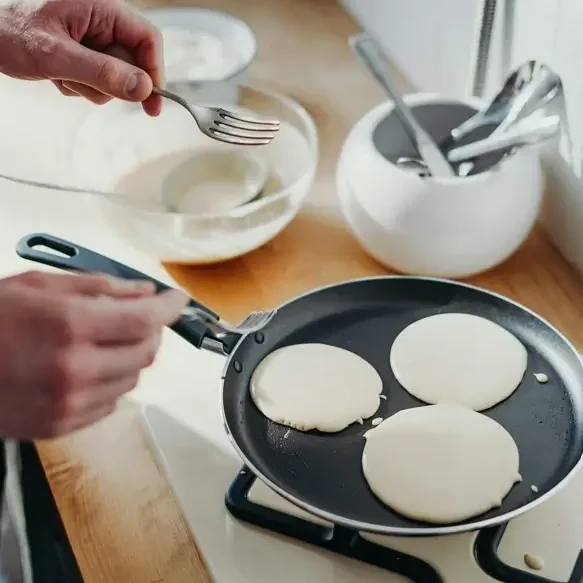 Pancakes made with sourdough batter that cook in a pan